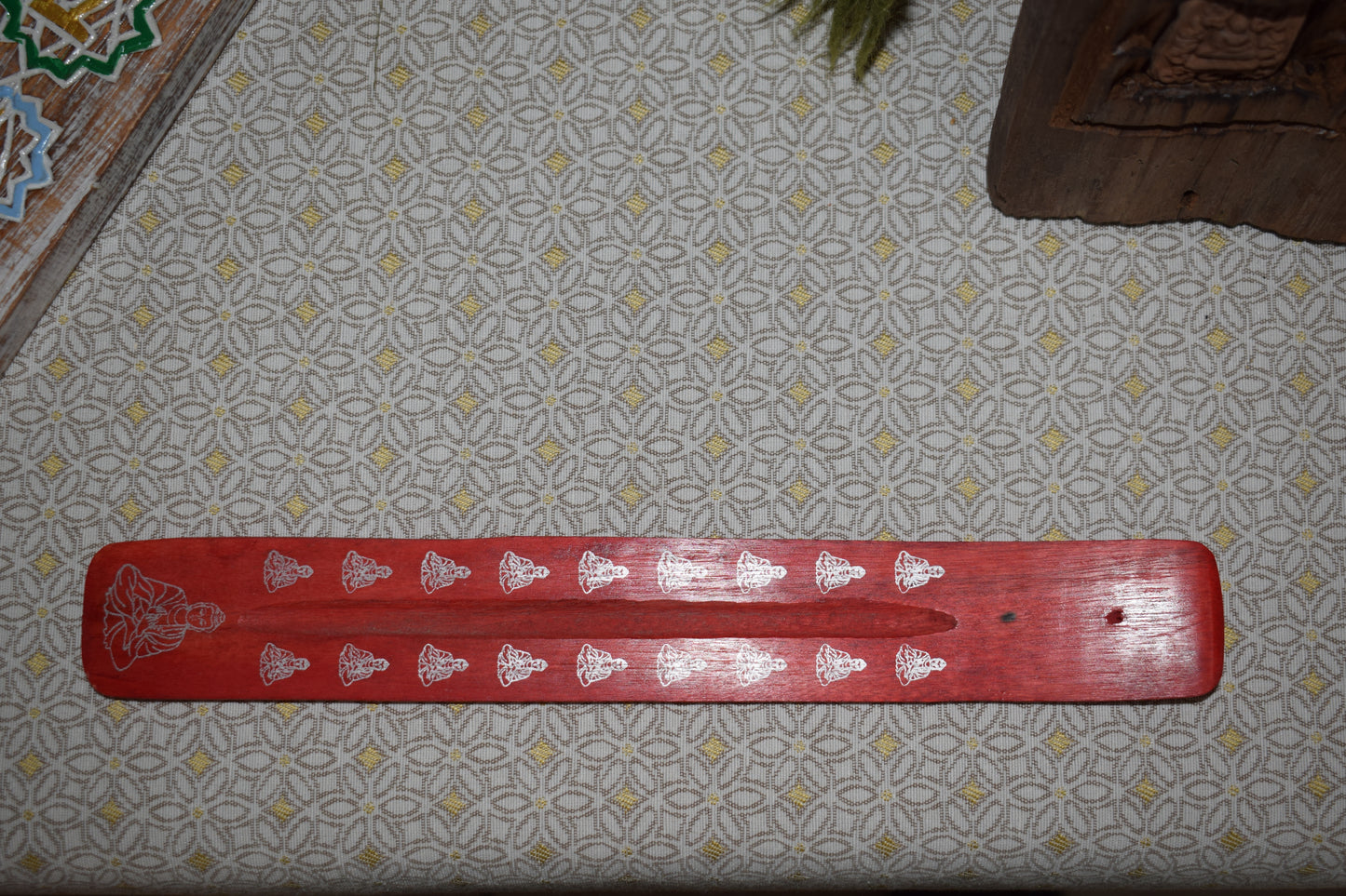 Porte encens bouddha rouge